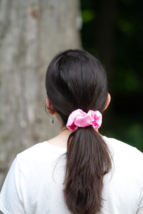 A young woman wearing a scrunchie
